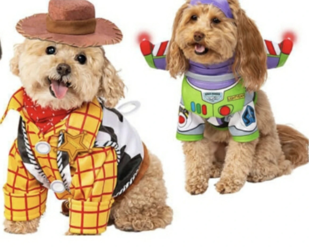 puppies wearing Disney character-themed costumes