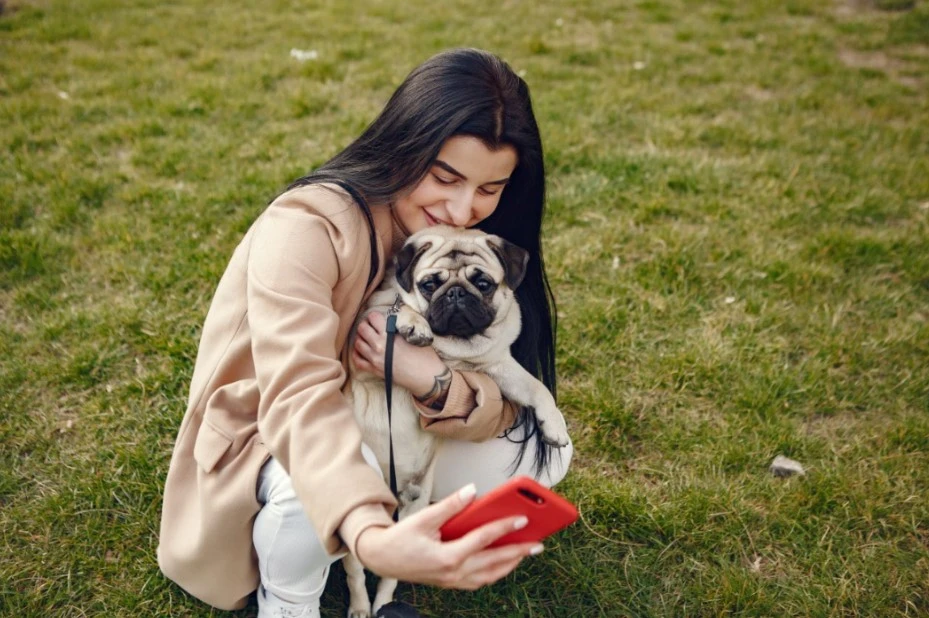 pet owner taking a selfie with her doggie